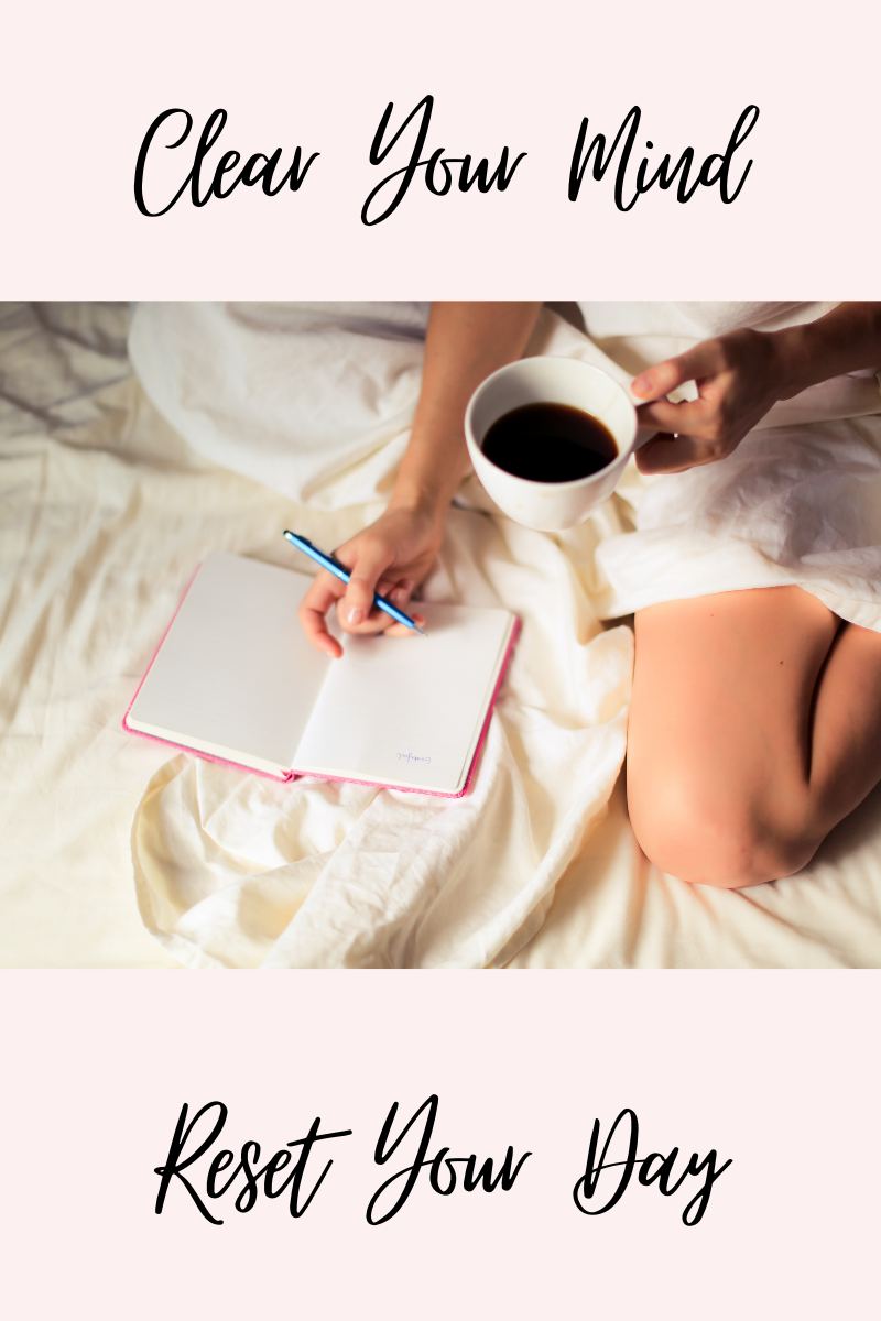 Woman sitting in bed journaling with a cup of coffee, reflecting as she works to reset and rebuild your life.